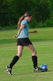 girl playing soccer